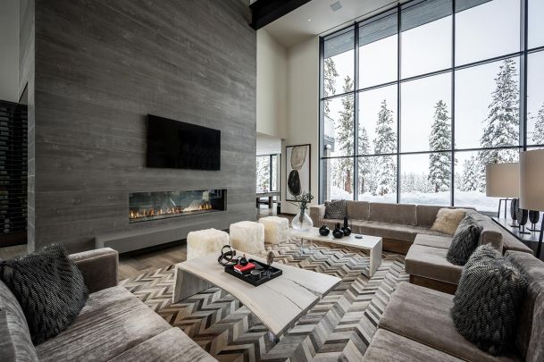 Modern living room with white walls and an accent grey wall with a TV