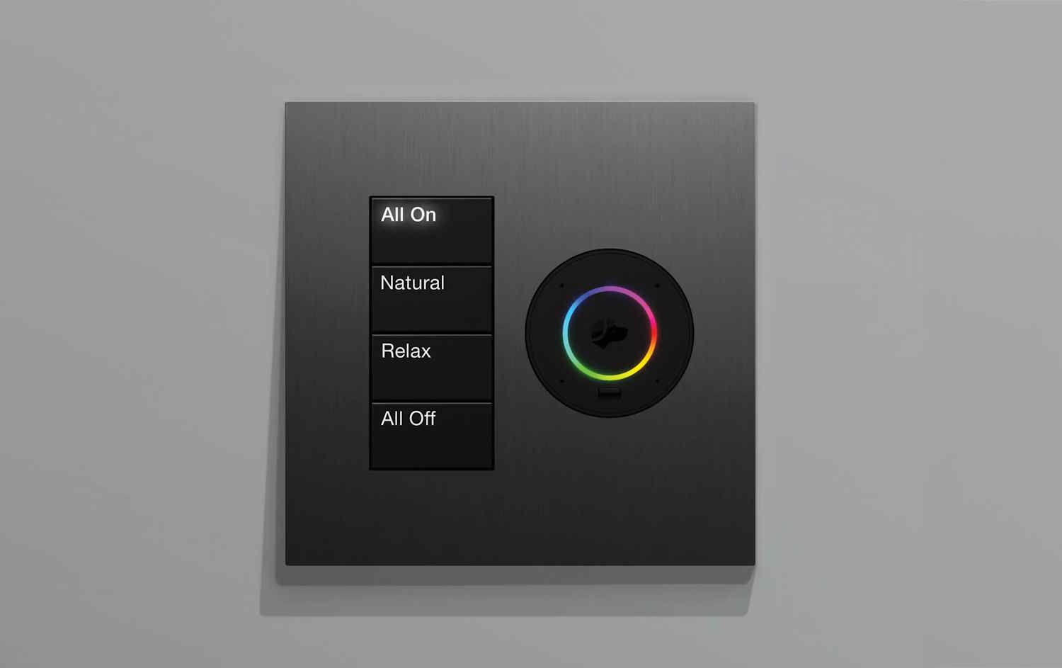 Modern wall‑mounted Lutron lighting control panel with scene buttons and a circular color wheel for adjusting light settings.