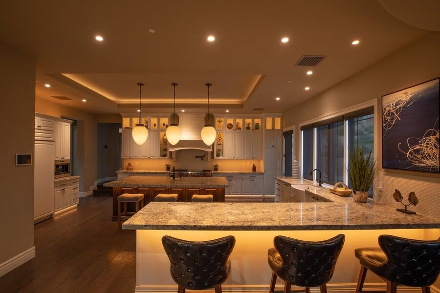 A kitchen space illuminated by Control4 lighting control fixtures.