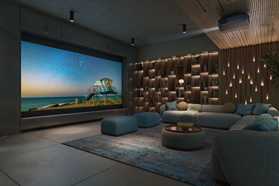 A casual home theater with a large movie screen, sectionals, and Sony projector.