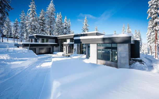 Modern house with snow all around