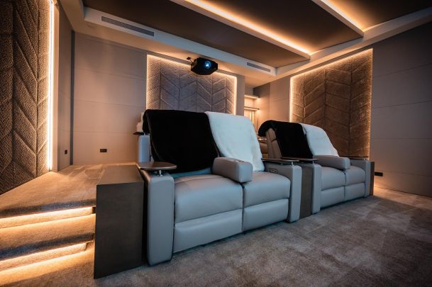 Home theater with LED lighting in neutral colors
